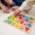 Closeup of Child's hands playing with alphabet-toy-block